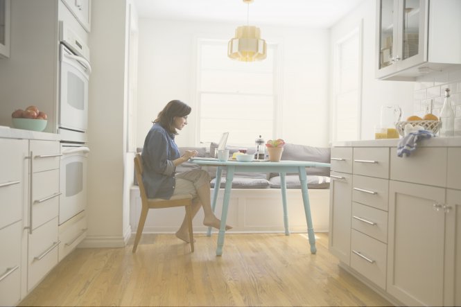 Woman works from home, wondering