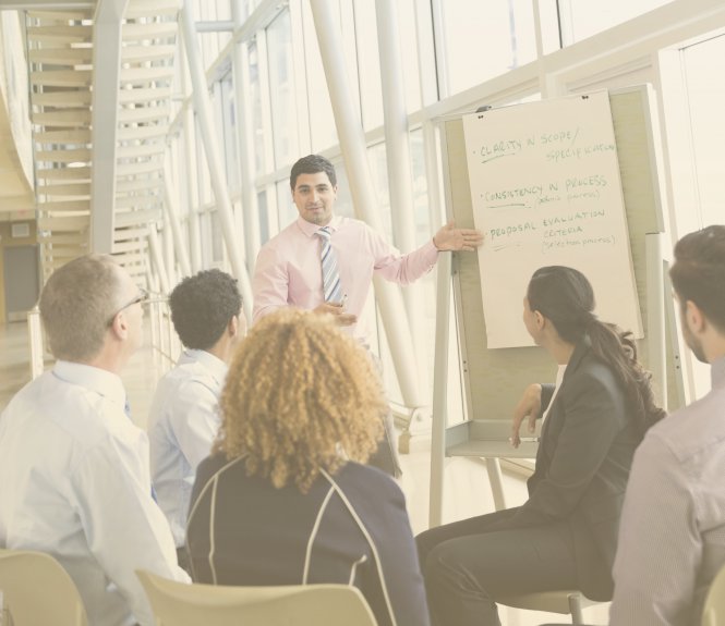 An executive teaching his team the business continuity planning steps