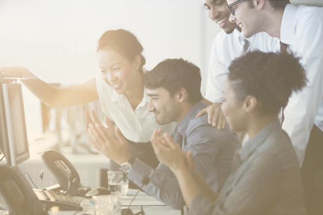 A group of coworkers enjoying developer community when discussing an API integration