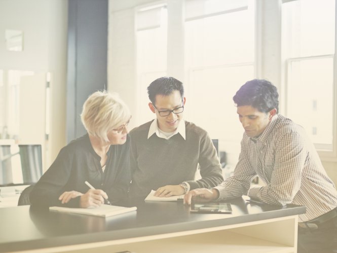 Three college admissions colleagues use higher education UCaaS solutions to make decisions