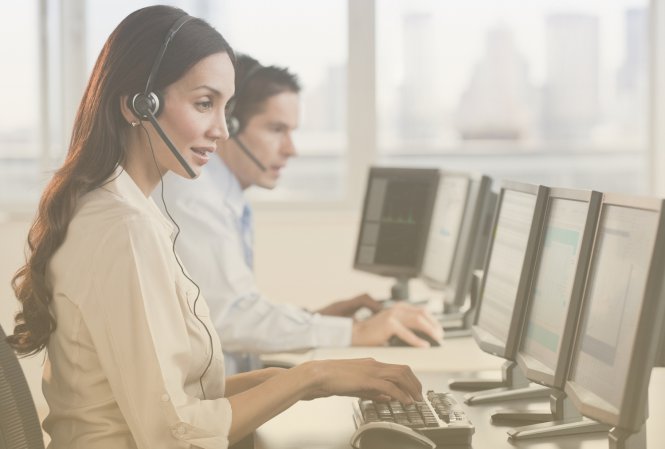 Call center employees enjoying the benefits of SIP trunking as they answer calls