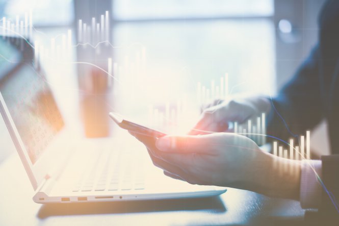 Person using a Slack integration on their smartphone and laptop