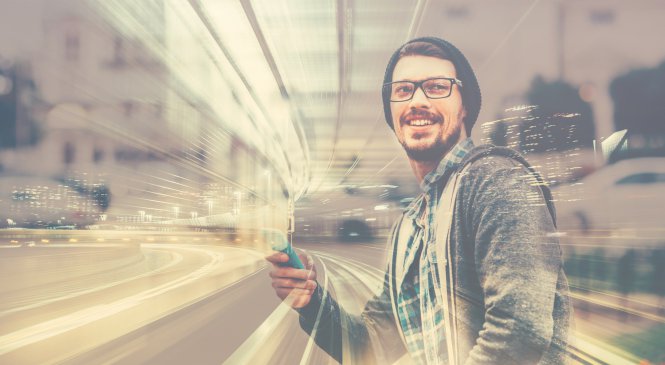 Person using mobile device to engage with a business in the city — humans and automation