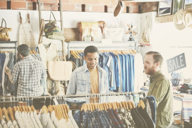 Three customers shopping at a retail clothing store — exceeding customer expectations