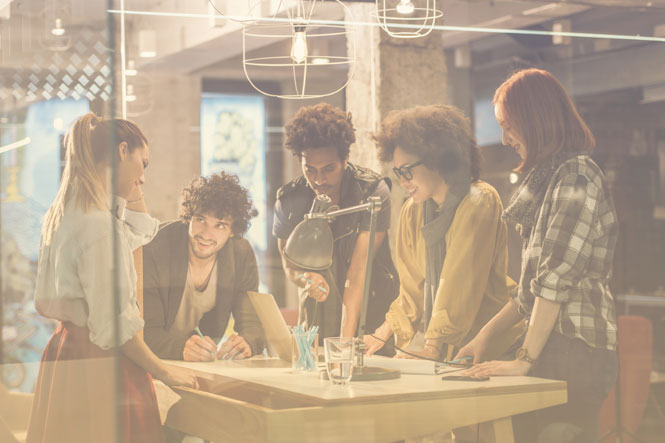 Colleagues collaborate on a work project using business communication systems