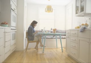 Woman works from home, wondering "How does the cloud work for remote employees?"