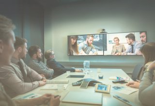 Sip trunk channels facilitate a videoconference between remote and in-house workers