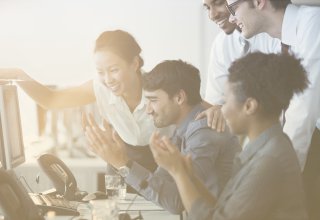 A group of coworkers enjoying developer community when discussing an API integration