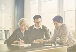 Three college admissions colleagues use higher education UCaaS solutions to make decisions