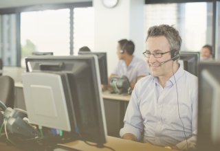 Gamification in business in action: Contact center agent sitting at his computer