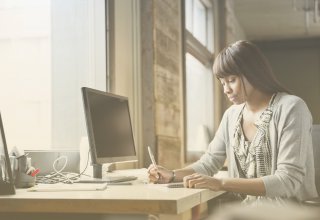 Employee working from home as part of her company's policy on work from home jobs