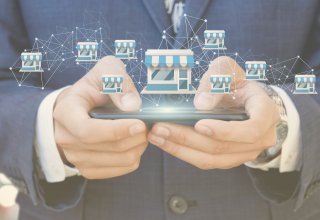 Person using mobile device with symbols representing franchise high-volume recruiting