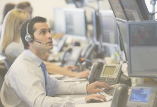 Employee at a finance firm using unified communications to improve work productivity
