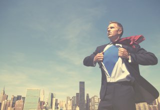 Person against cityscape opening button-down shirt — communication best practices in the workplace