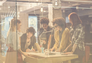 Colleagues collaborate on a work project using business communication systems 